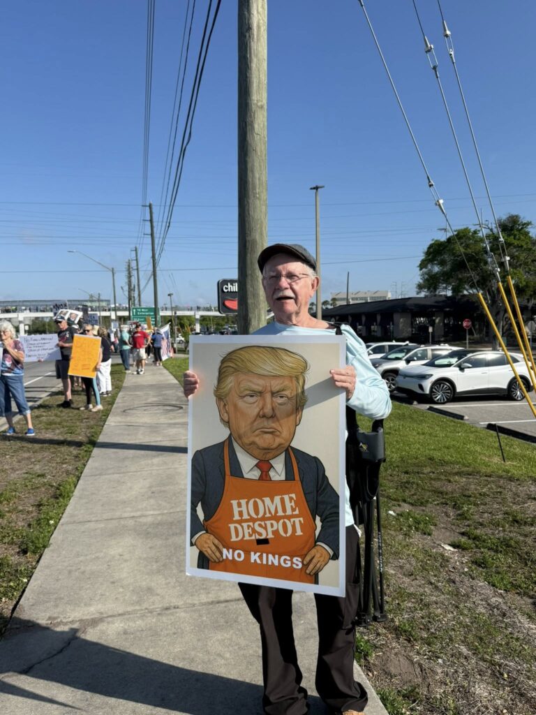 Fight back protester Home Despot No Kings sign, Tampabay FL