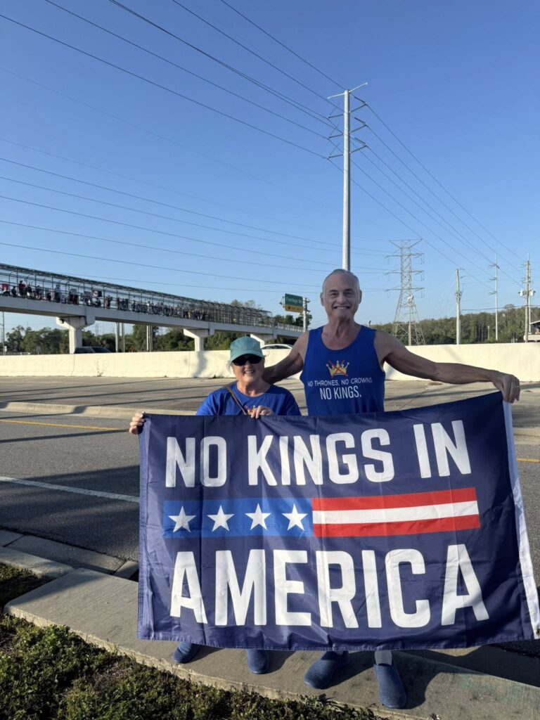 Banner says No Kings in America at the Duke Energy Overpass Bridge, Indivisile North Pinellas