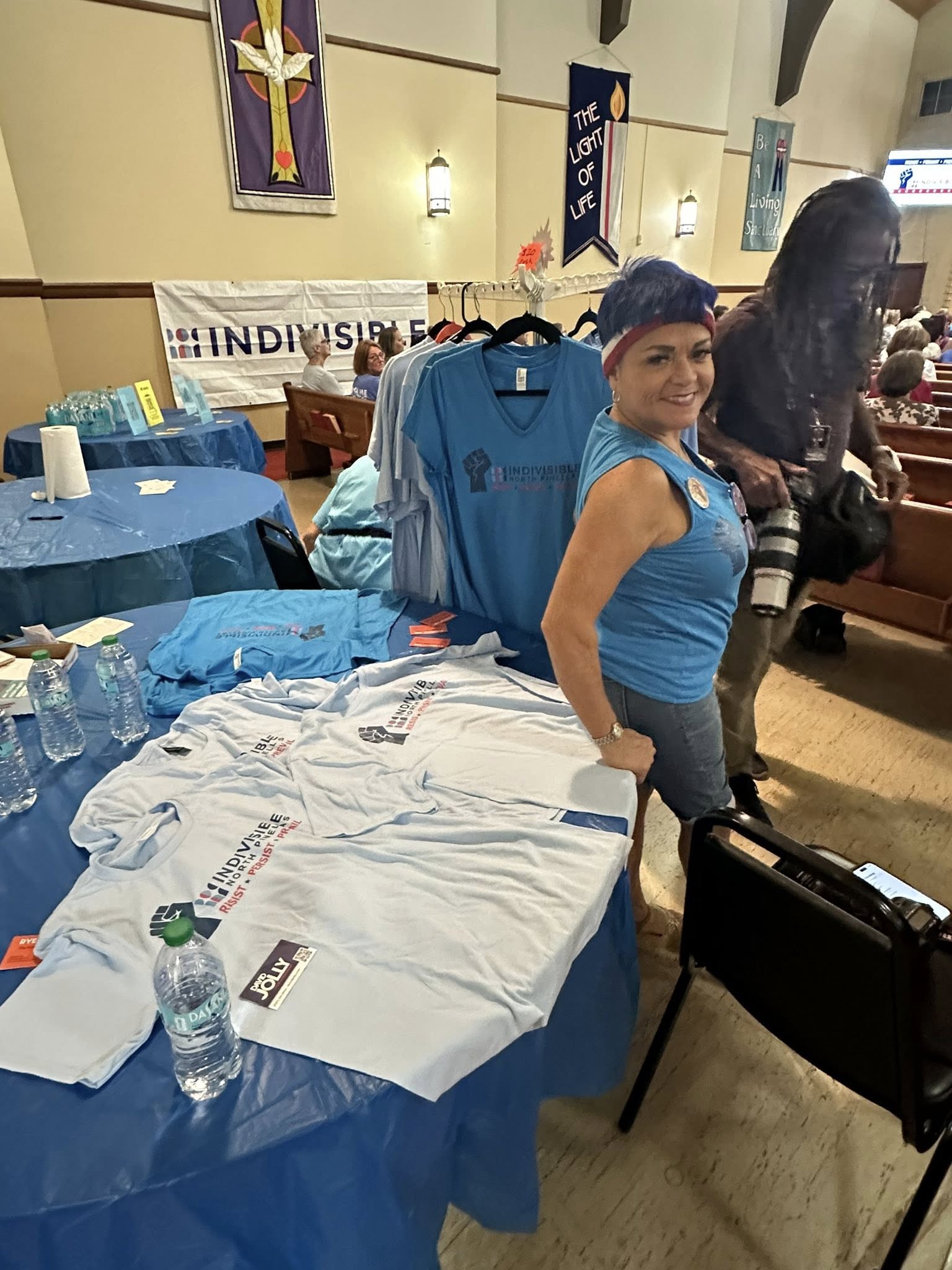 INP volunteer at the merchandise table during the David Jolly Town Hall
