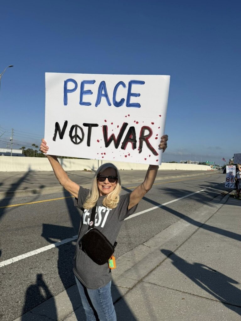 Peace not war sign at Operation Overpass bridge demonstration in Clearwater, FL