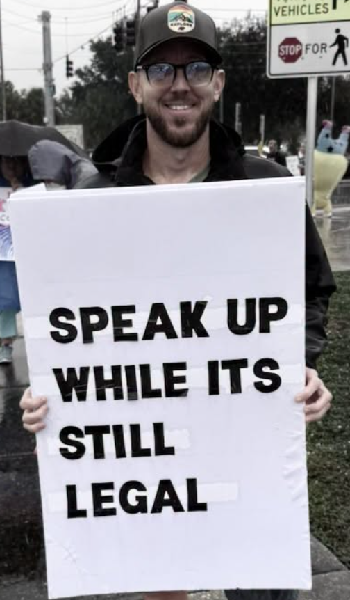 Man with sing Speak up while its still legal Clearwater FL