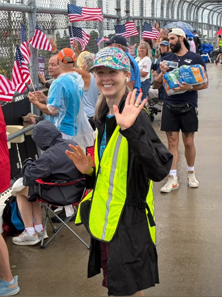 Young girl waving during a Operation Overpass rainy day 101726