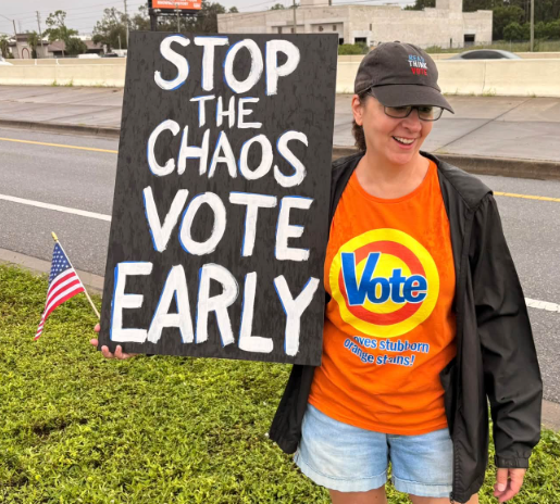 Lady in Vote t-shirt with sign Stop the chaos vote early