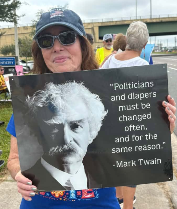 Woman's sign Politicians and diapers must be changed often and for the same reason. Mark Twain