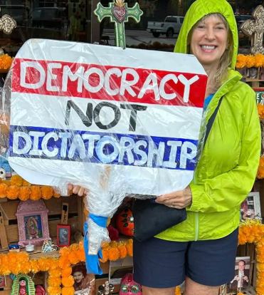 Young lady sing says Democracy not Dictatorship